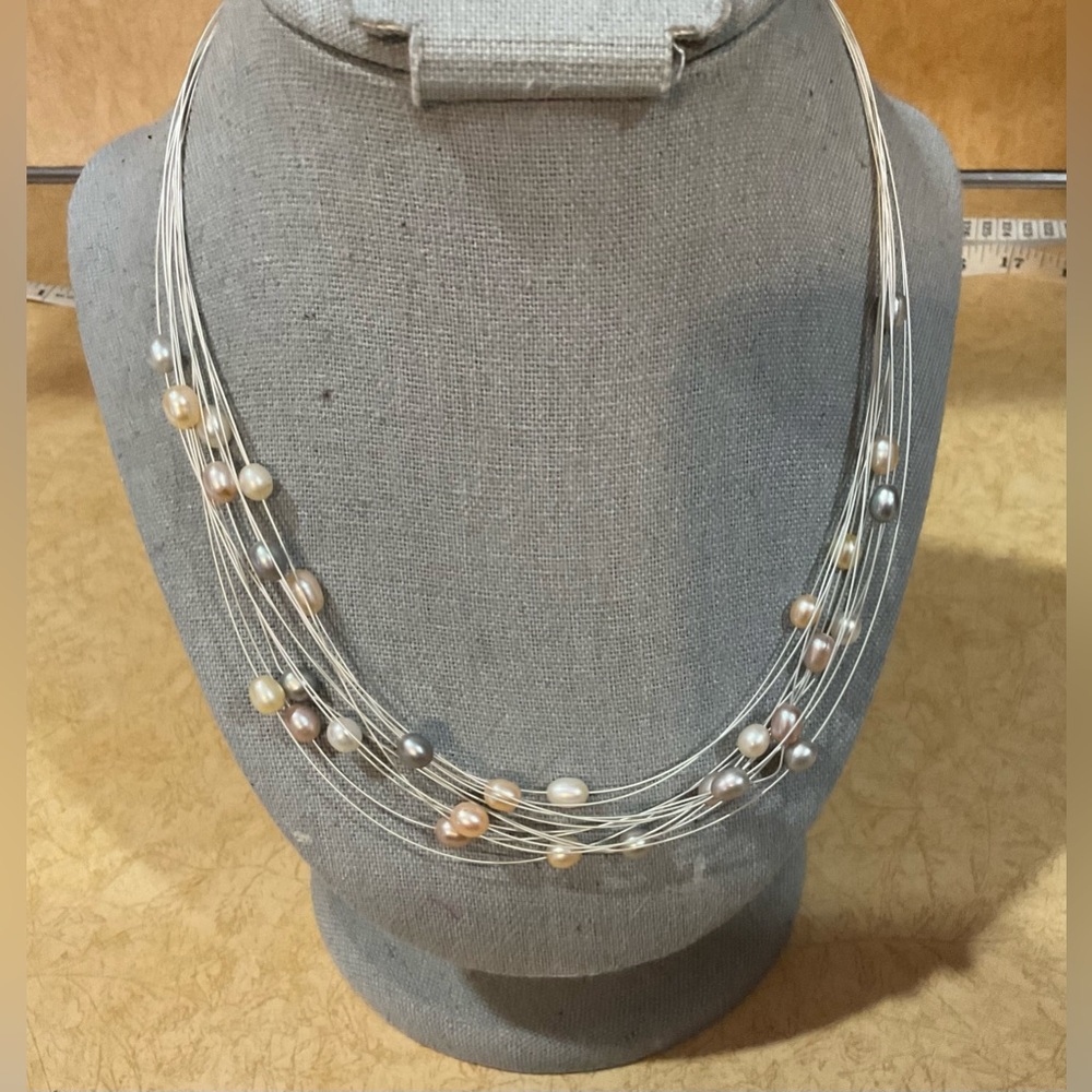 Honora:  Wire multi color string fresh. Water pearls about/ approximately 18” i